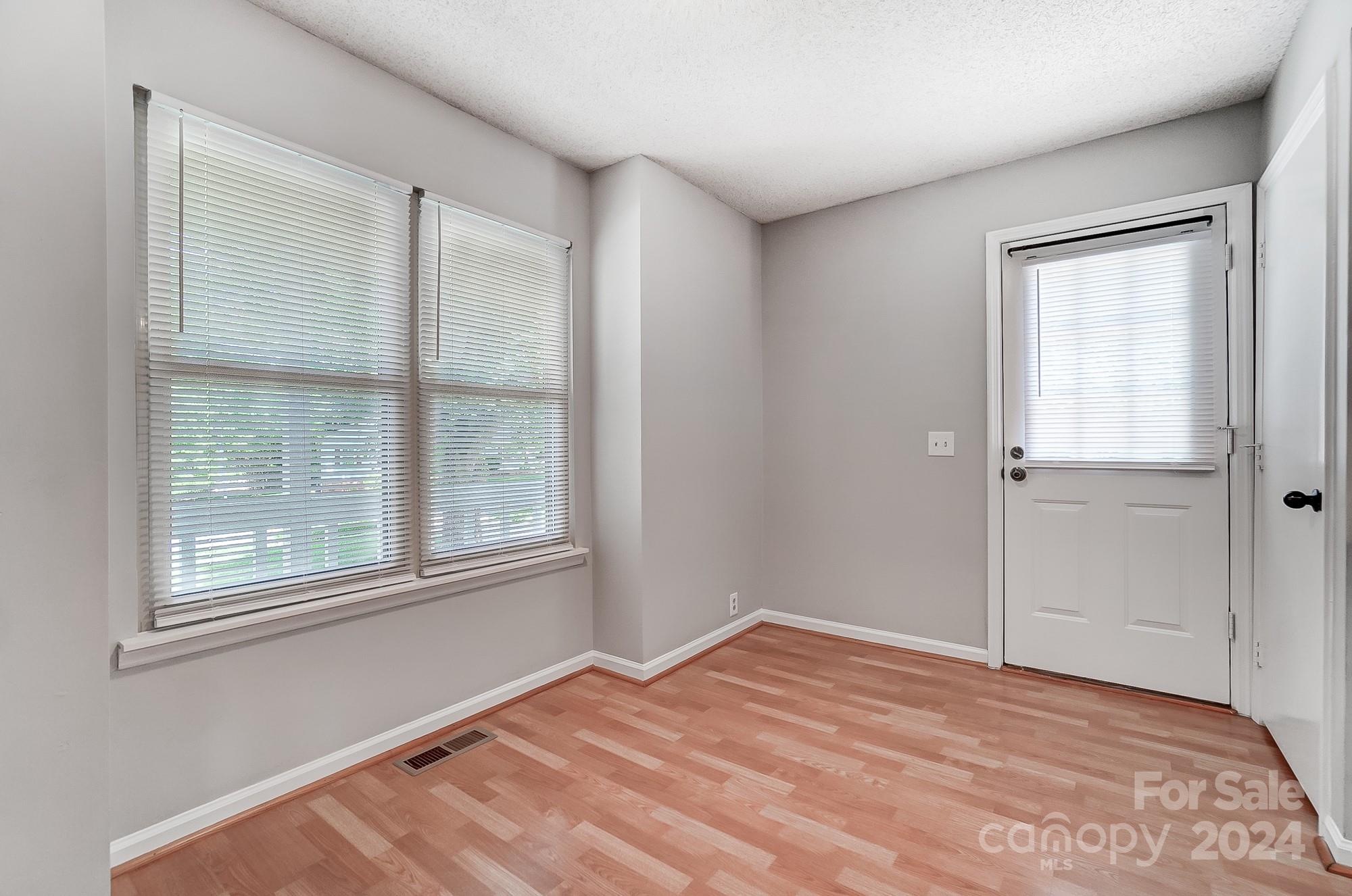 6510 Patchwork Circle Charlotte, NC 28270 - Photo 34 of 48 a view of empty room with wooden floor and fan