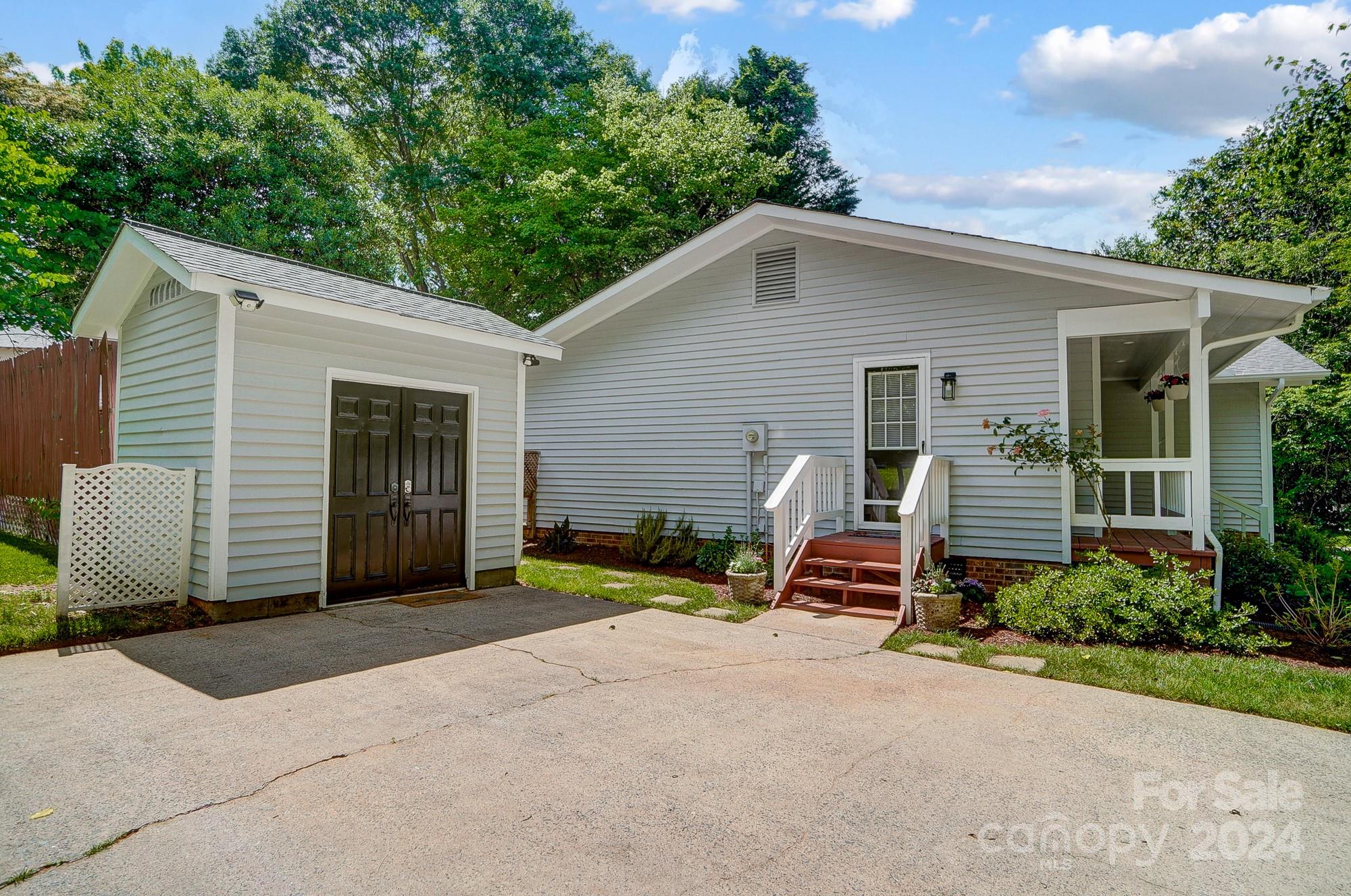 6510 Patchwork Circle Charlotte, NC 28270 - Photo 46 of 48 a view of a house with a yard and garage