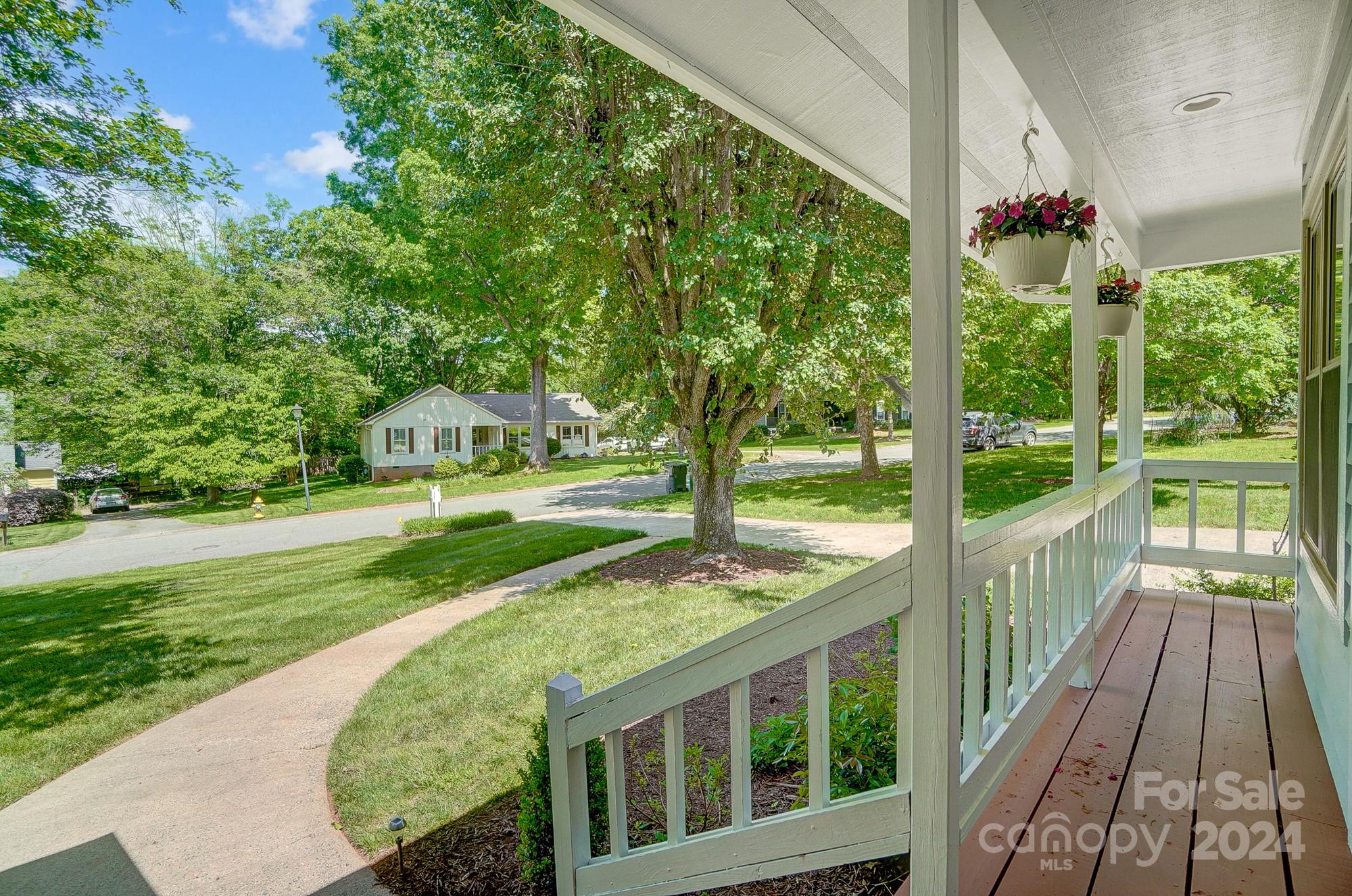 6510 Patchwork Circle Charlotte, NC 28270 - Photo 5 of 48 a view of a porch with a big yard potted plants and large tree