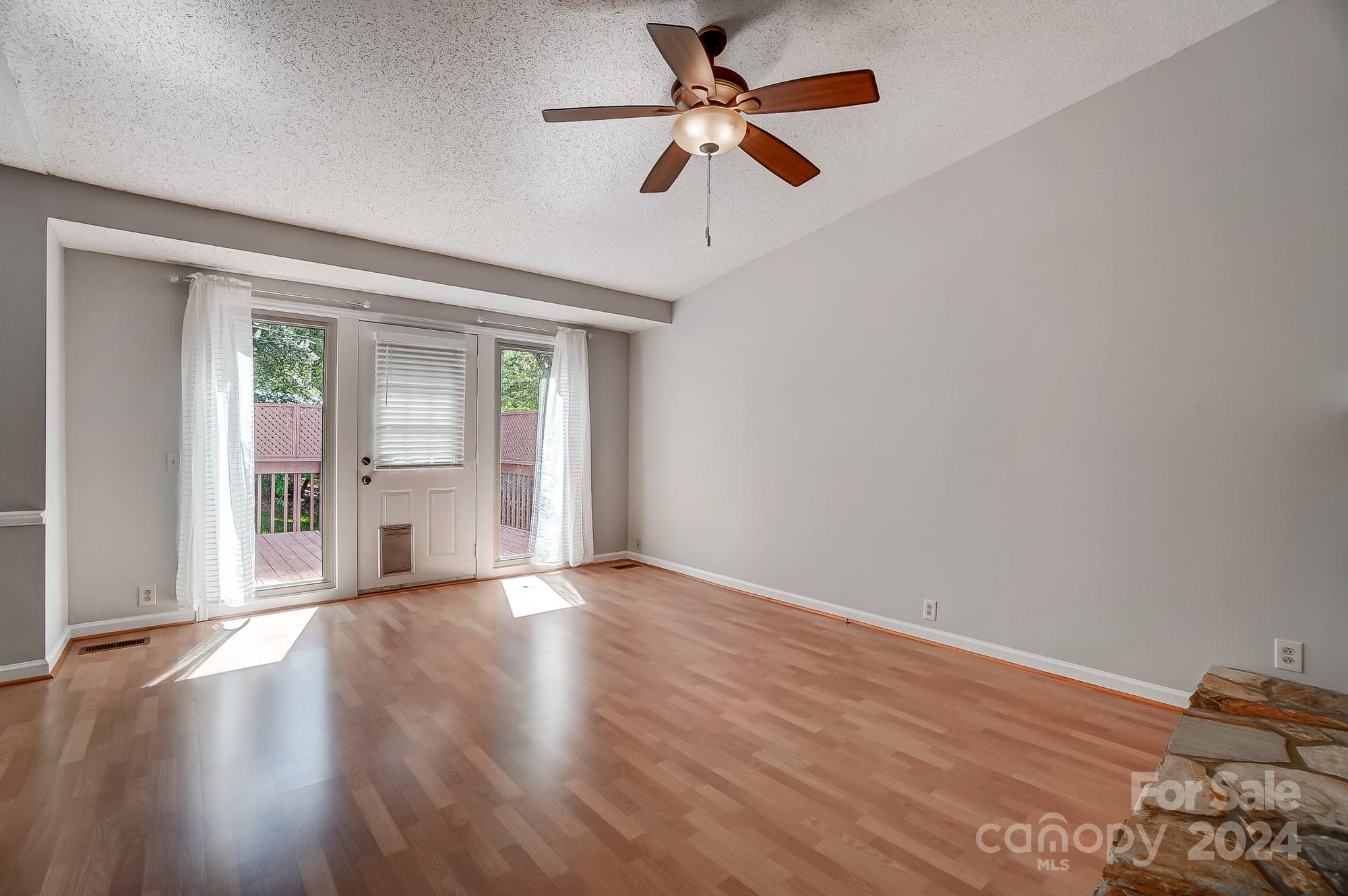 6510 Patchwork Circle Charlotte, NC 28270 - Photo 8 of 48 a view of empty room with wooden floor and fan