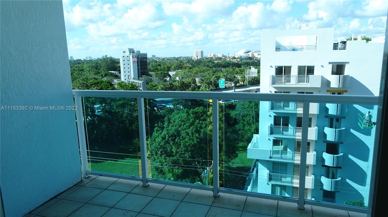 a view of a balcony with an outdoor space