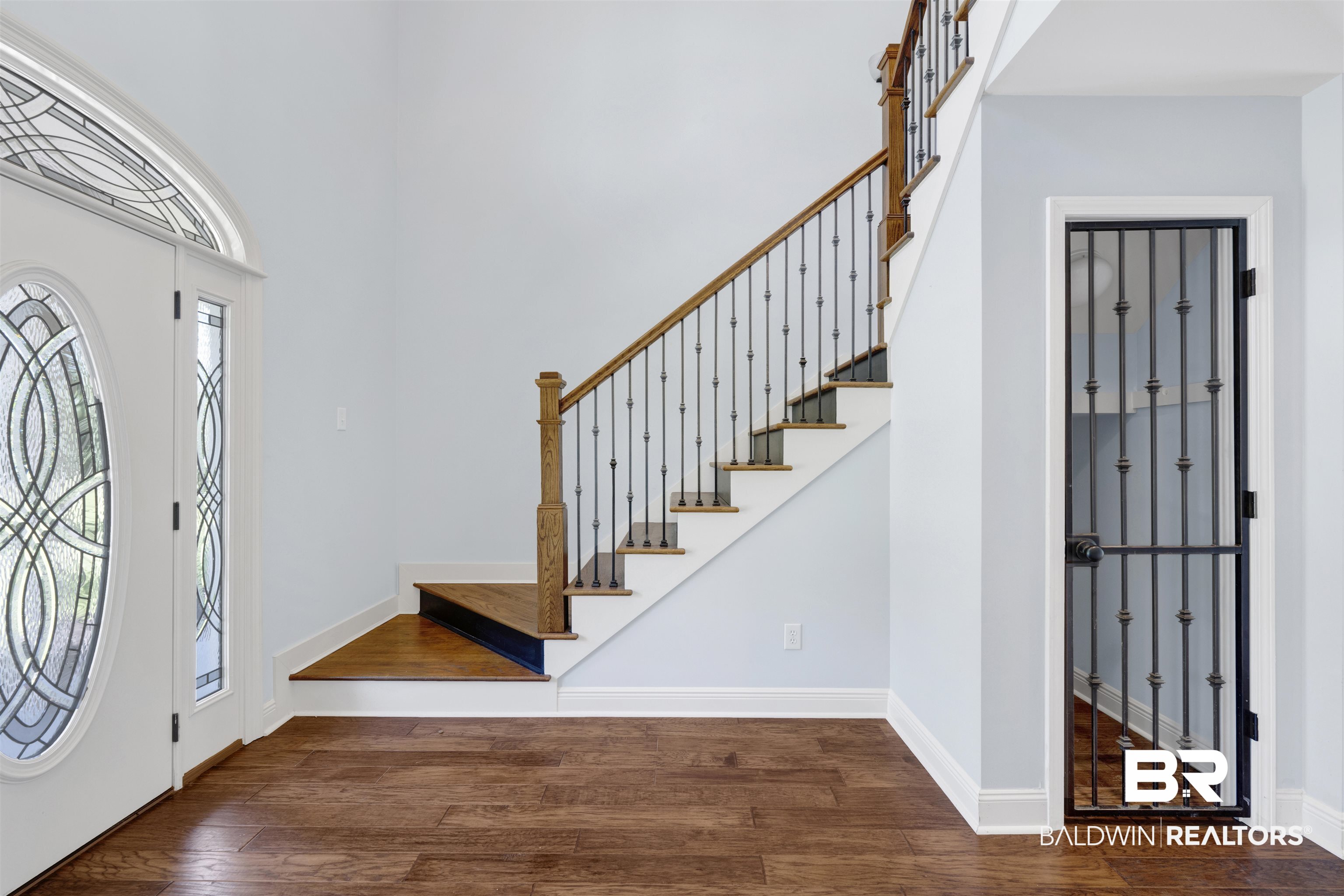 12944 Anna's Way Stapleton, AL 36578 - Photo 32 of 64 Entry foyer featuring wood-finish flooring and a decorative leaded-glass front door with transom