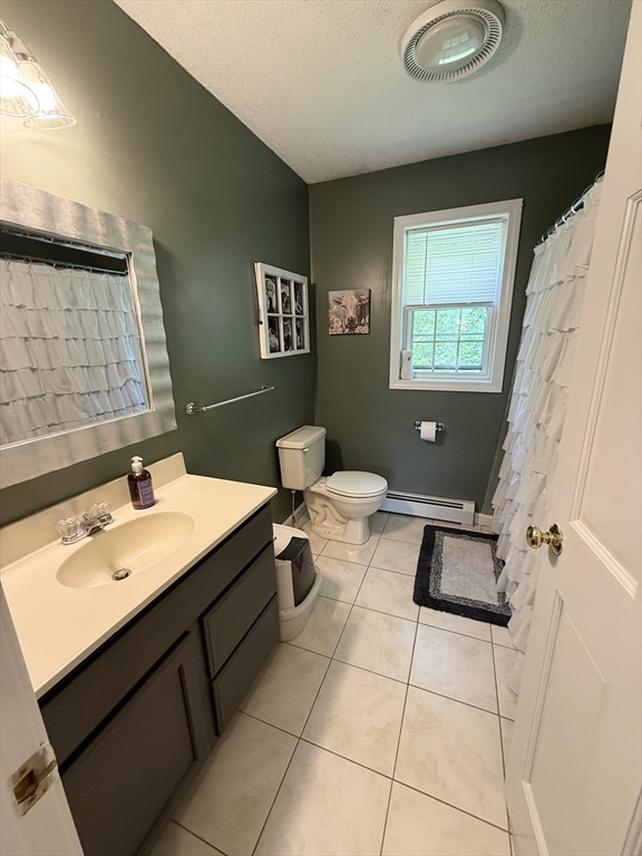 222 Bridge Street Warren, MA 01083 - Photo 24 of 40 a bathroom with a sink a toilet and mirror