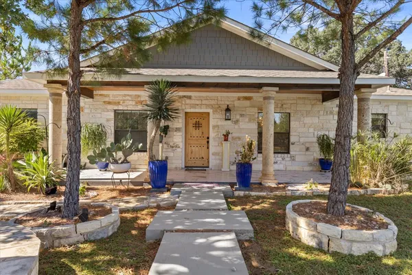 a front view of a house with a porch