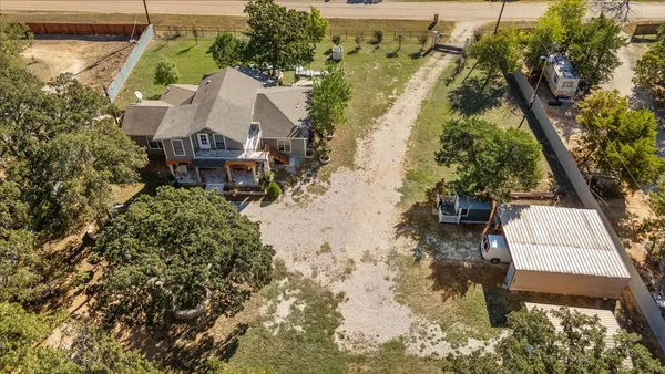 an aerial view of residential house with outdoor space