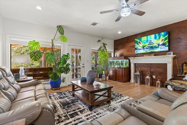 a living room with furniture and a fireplace