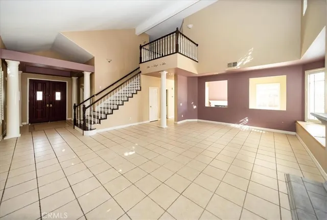 a view of an entryway and livingroom