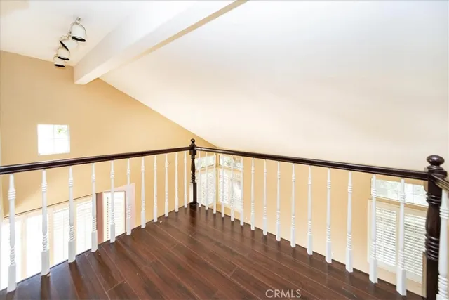 a view of staircase with wooden floor and fan
