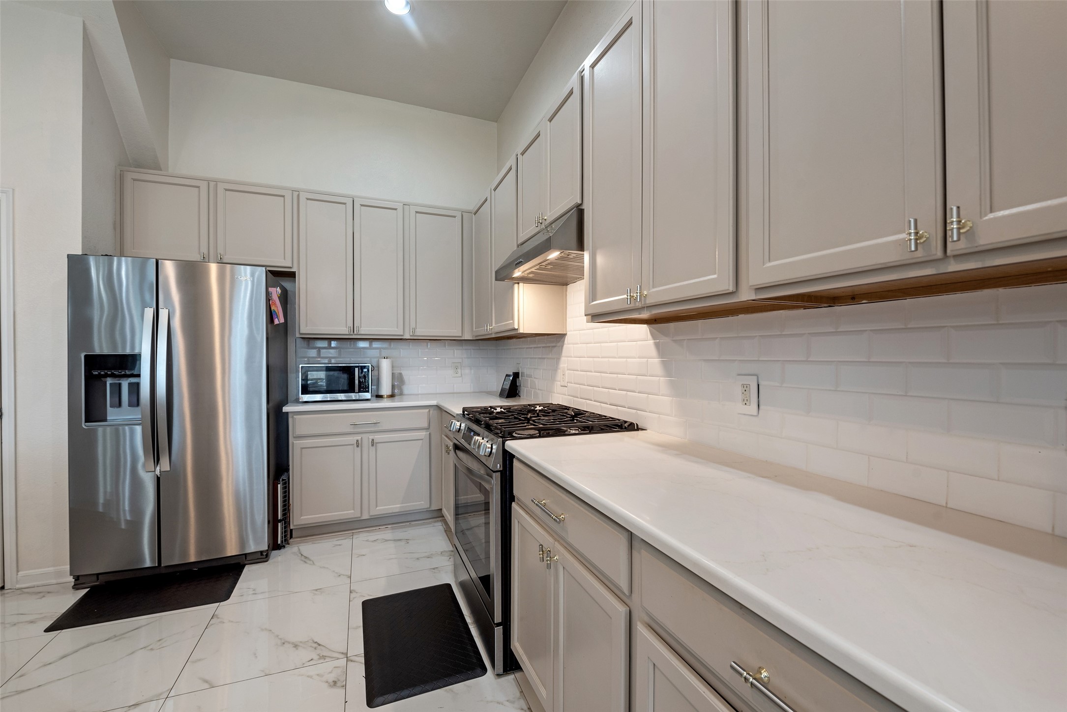 3554 Bennett Trails Drive Spring, TX 77386 - Photo 11 of 44 a kitchen with a refrigerator sink and cabinets