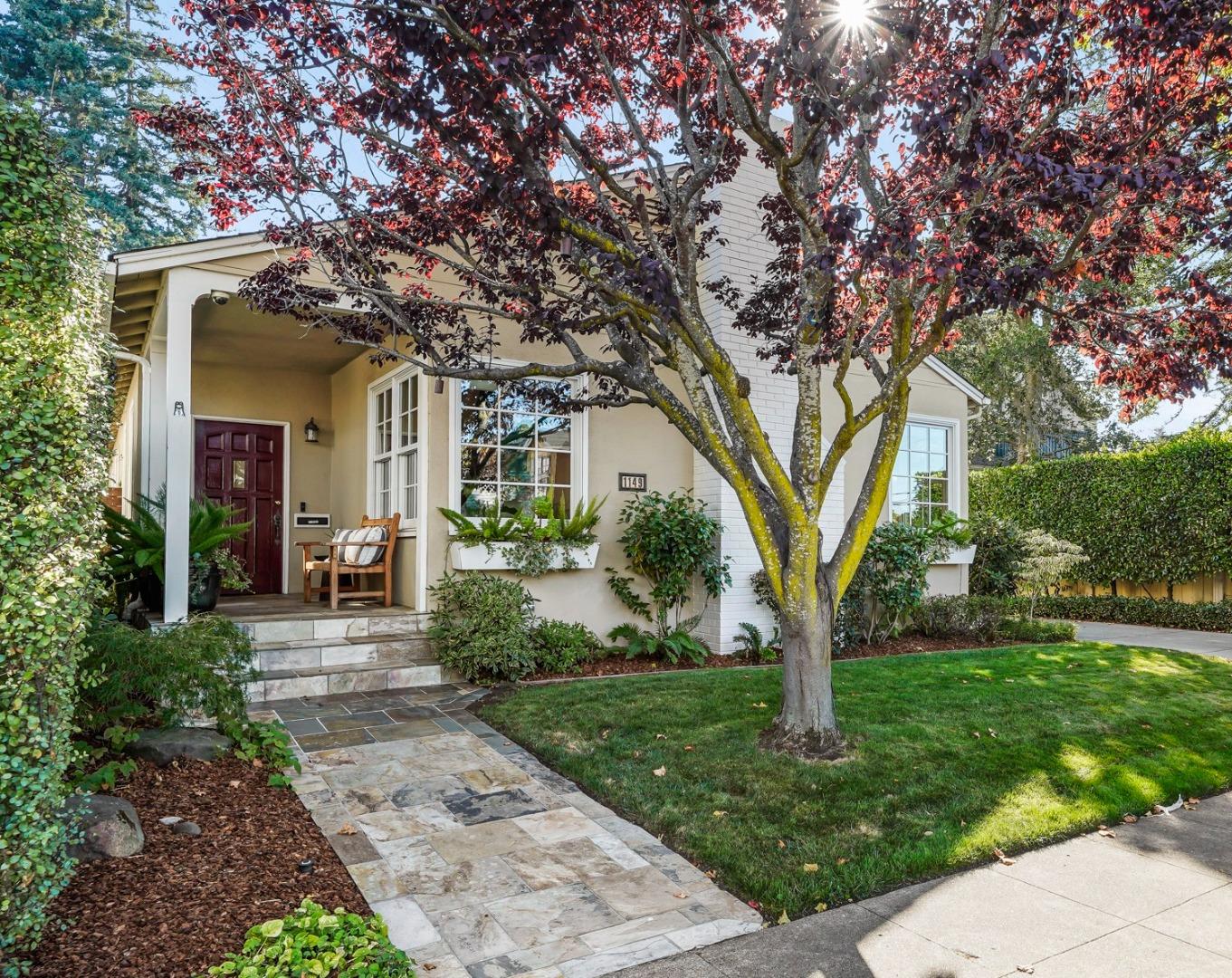 a front view of a house with garden