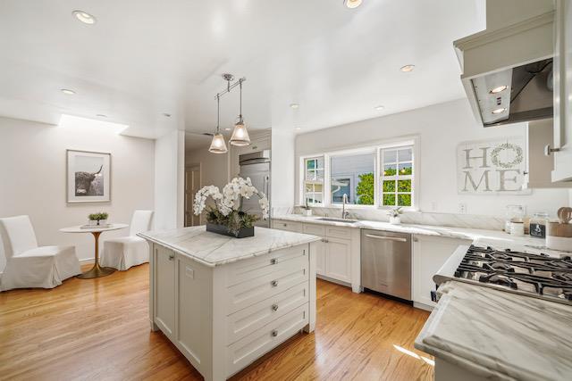 1149 Cortez Avenue Burlingame, CA 94010 - Photo 2 of 8 a kitchen with white cabinets and appliances