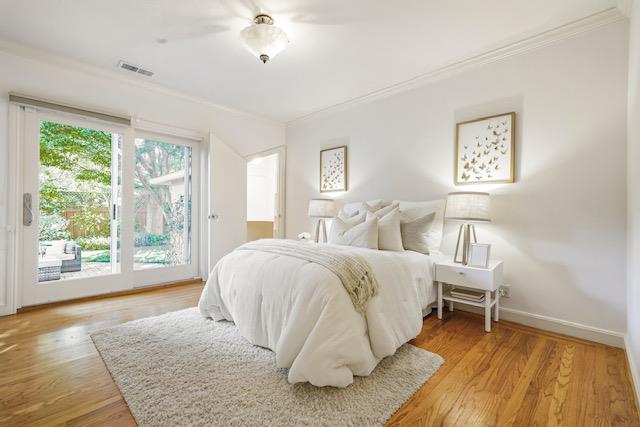 1149 Cortez Avenue Burlingame, CA 94010 - Photo 7 of 8 a spacious bedroom with a bed and a large window