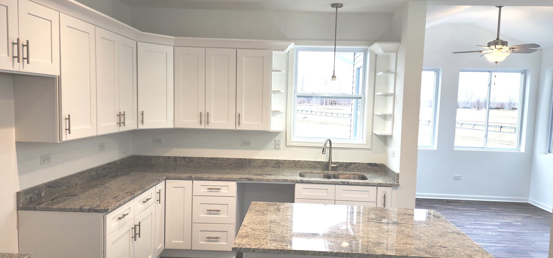25624 Fieldstone Court Channahon, IL 60410 - Photo 5 of 15 a kitchen with granite countertop a sink stove and cabinets