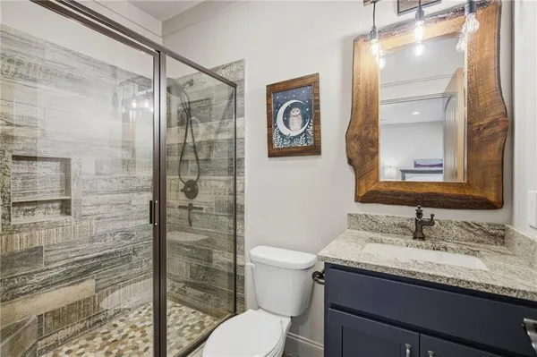 a view of a house with a yard and wooden fence