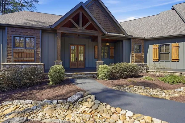 a front view of a house with garden