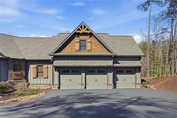 a view of a livingroom with furniture and chandelier