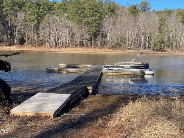 2897 Jacksontown Road Manson, NC 27553 - Photo 1 of 5 a view of a lake with a house in the background