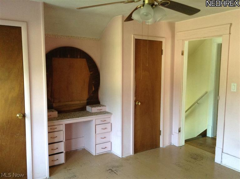 43725 Middle Ridge Road Lorain, OH 44053 - Photo 16 of 25 Master bedroom with built ins and 3 closets