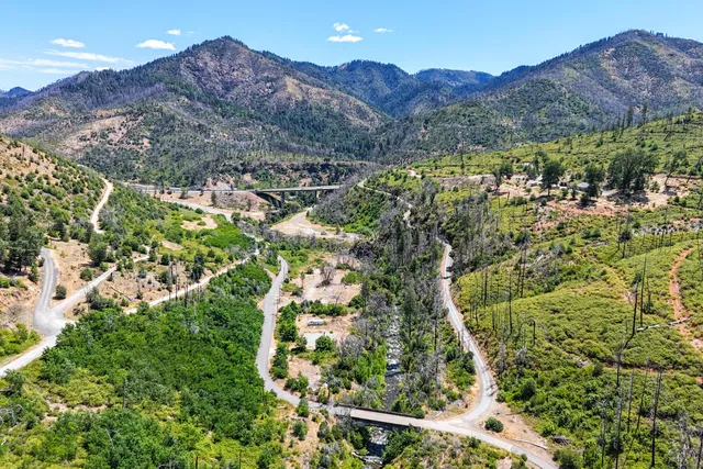 an aerial view of mountain with trees