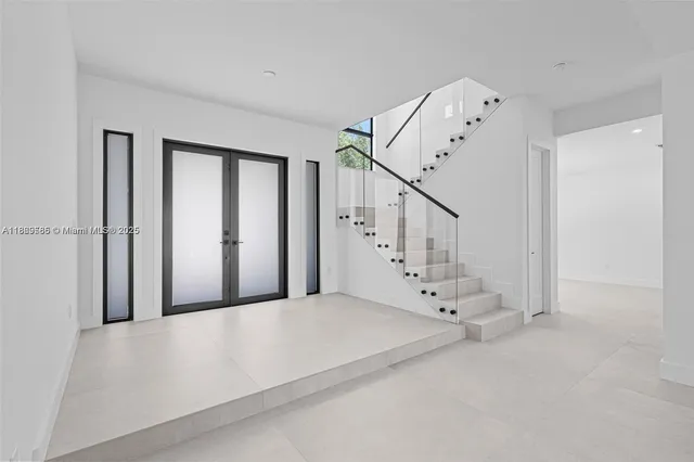 a view of staircase with white walls