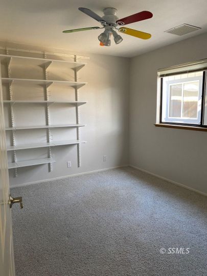 718 North Inyo Street Ridgecrest, CA 93555 - Photo 6 of 9 a view of an empty room with a window