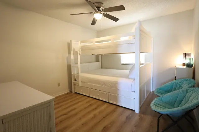 a en suite bathroom with a granite countertop sink and a mirror