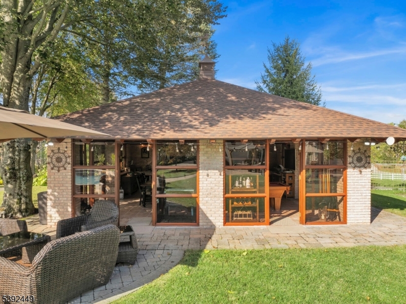 37 Pequest Road Andover, NJ 07821 - Photo 13 of 50 a front view of a house with garden