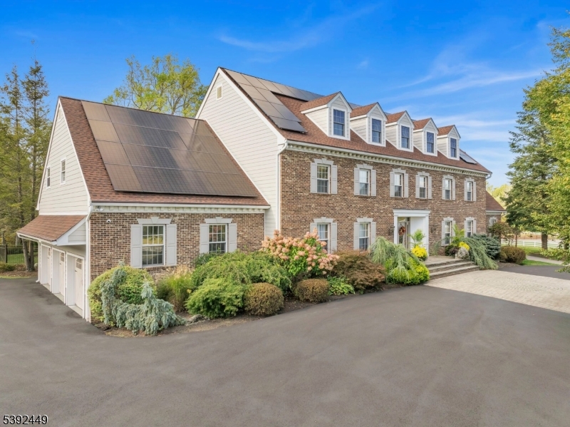 37 Pequest Road Andover, NJ 07821 - Photo 17 of 50 a front view of a house with a garden