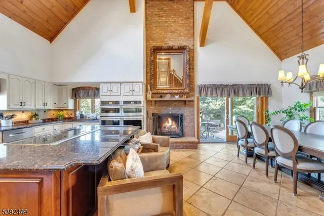 a kitchen with stainless steel appliances granite countertop a stove and a sink