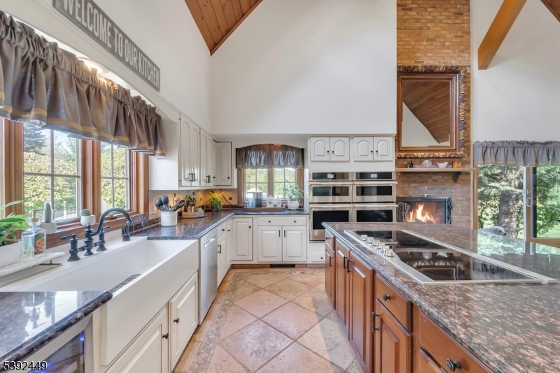 37 Pequest Road Andover, NJ 07821 - Photo 23 of 50 a kitchen with stainless steel appliances granite countertop a stove and a sink