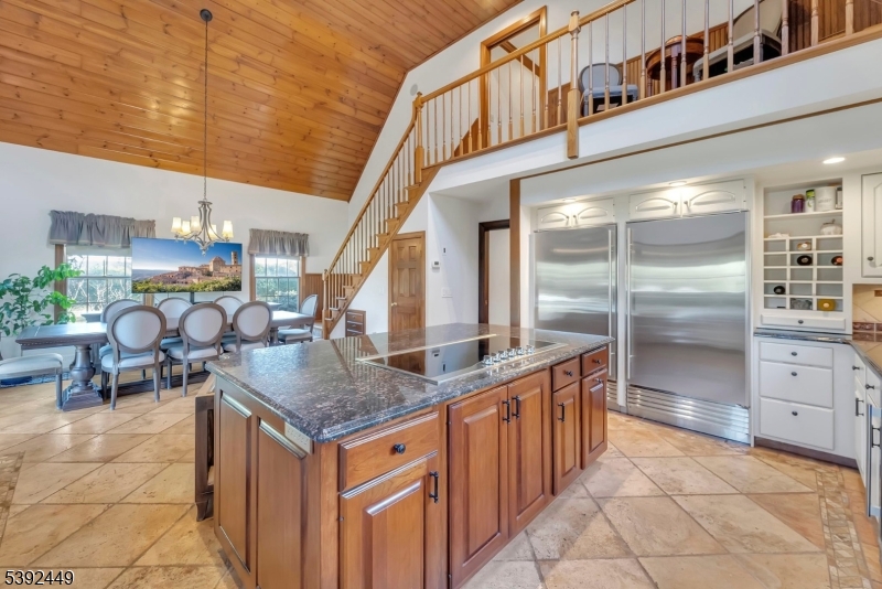 37 Pequest Road Andover, NJ 07821 - Photo 25 of 50 a kitchen with stainless steel appliances granite countertop a sink and a refrigerator
