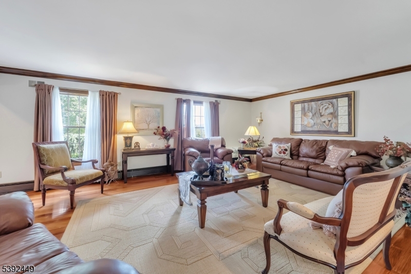 37 Pequest Road Andover, NJ 07821 - Photo 27 of 50 a living room with furniture and a large window