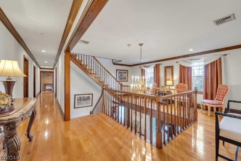 37 Pequest Road Andover, NJ 07821 - Photo 30 of 50 a view of an entryway wooden floor and chandelier