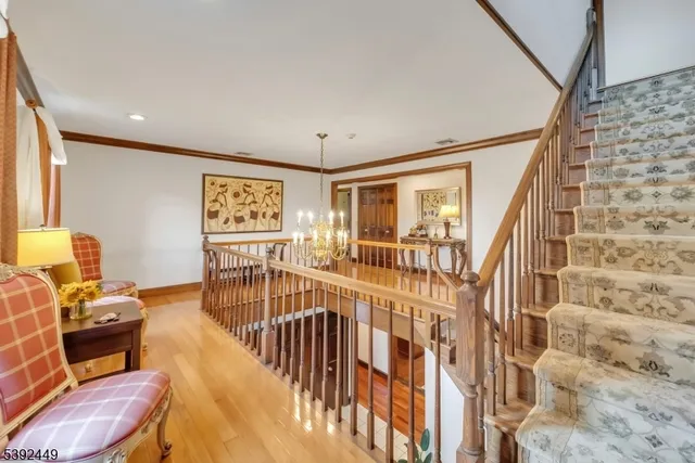 a bedroom with furniture and a large window