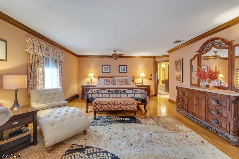 37 Pequest Road Andover, NJ 07821 - Photo 32 of 50 a bedroom with furniture and a large window