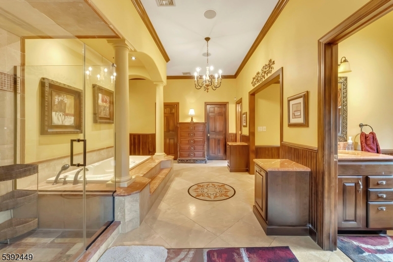 37 Pequest Road Andover, NJ 07821 - Photo 34 of 50 a bathroom with a tub sink and mirror
