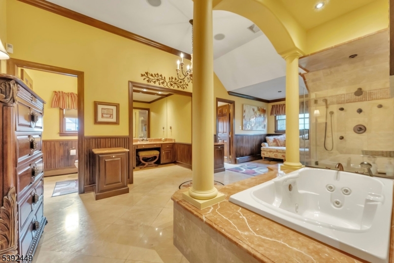 37 Pequest Road Andover, NJ 07821 - Photo 35 of 50 a en suite bathroom with a tub sink and mirror