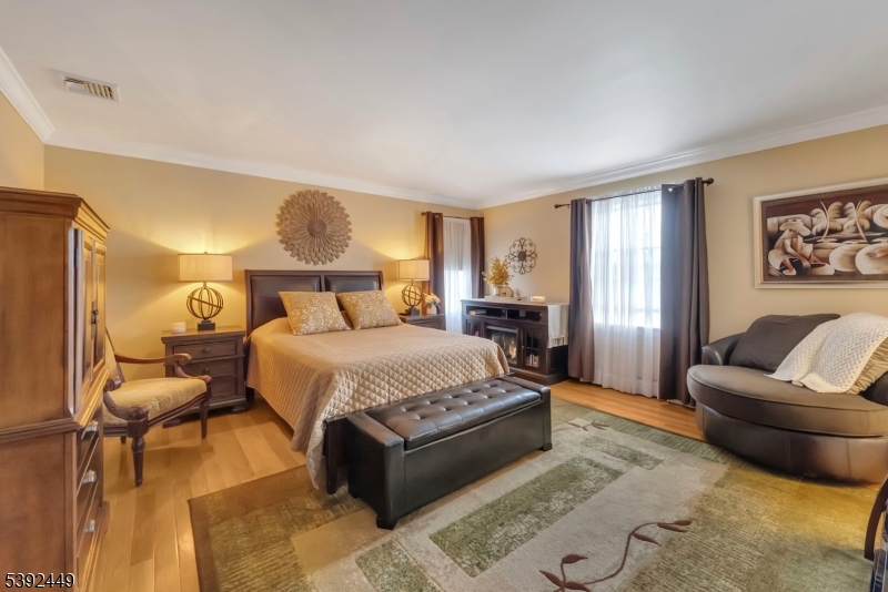 37 Pequest Road Andover, NJ 07821 - Photo 36 of 50 a bedroom with a bed and glass window