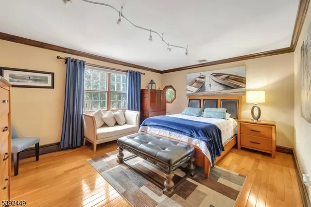 a bathroom with a granite countertop sink mirror vanity and toilet