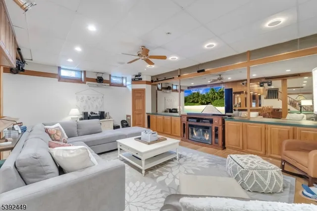 a kitchen with a dining table chairs and white appliances
