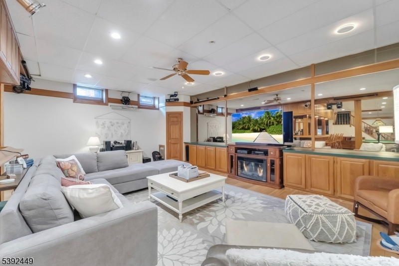 37 Pequest Road Andover, NJ 07821 - Photo 41 of 50 a living room with furniture and a fireplace