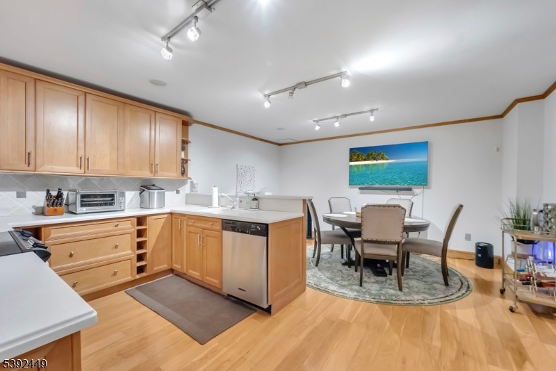 37 Pequest Road Andover, NJ 07821 - Photo 42 of 50 a kitchen with a dining table chairs and white appliances