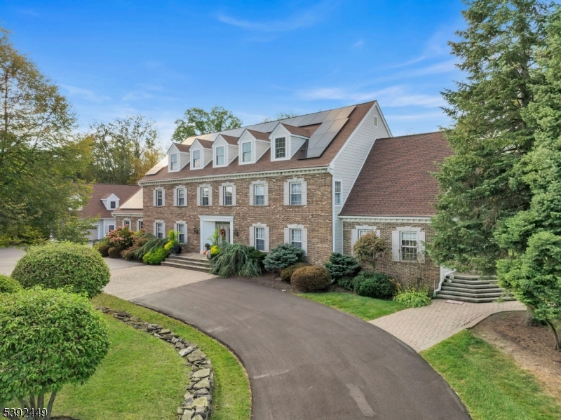 37 Pequest Road Andover, NJ 07821 - Photo 6 of 50 a front view of a house with a garden