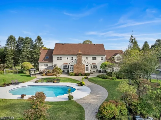 a view of a swimming pool with an outdoor space and seating area
