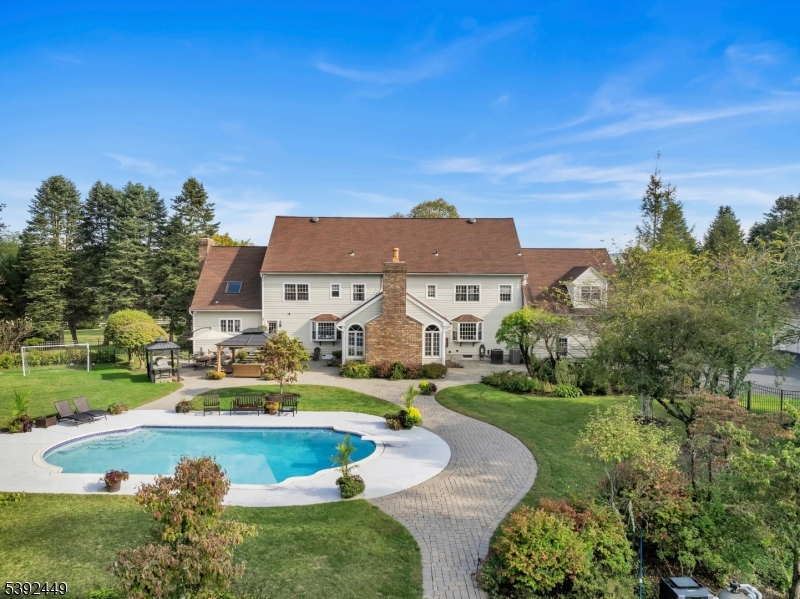 37 Pequest Road Andover, NJ 07821 - Photo 10 of 50 an aerial view of a house with swimming pool garden and patio
