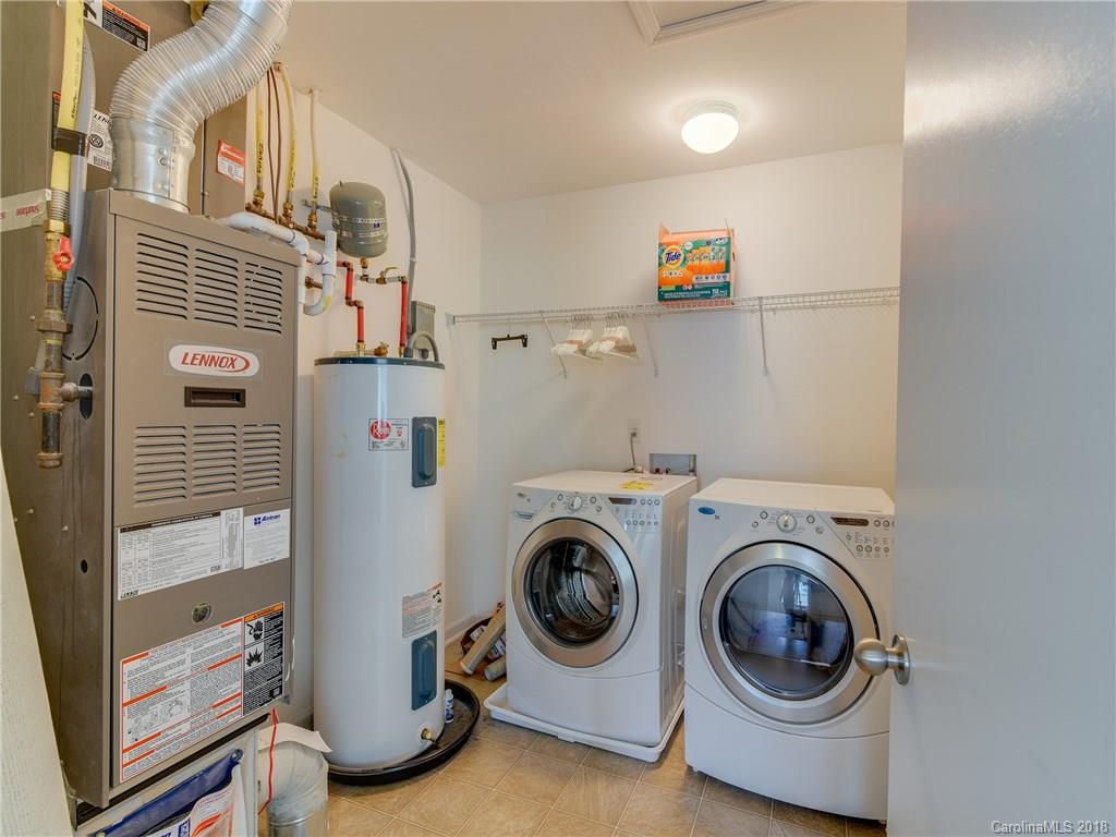 9502 Fernspray Road Charlotte, NC 28215 - Photo 11 of 20 a utility room with dryer and washer