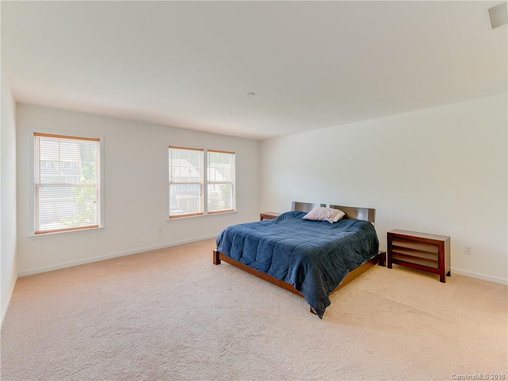 9502 Fernspray Road Charlotte, NC 28215 - Photo 12 of 20 a living room with a bed furniture and a window