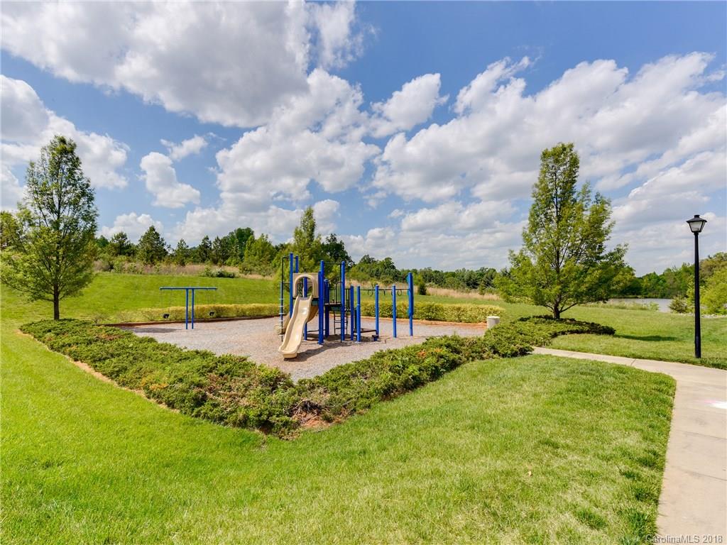 9502 Fernspray Road Charlotte, NC 28215 - Photo 17 of 20 a view of a park with swings and slides