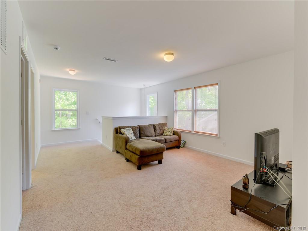 9502 Fernspray Road Charlotte, NC 28215 - Photo 9 of 20 a living room with furniture and a window