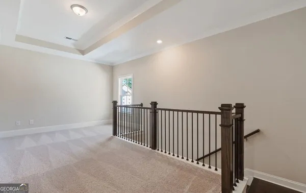 a view of a livingroom with a furniture and a ceiling fan